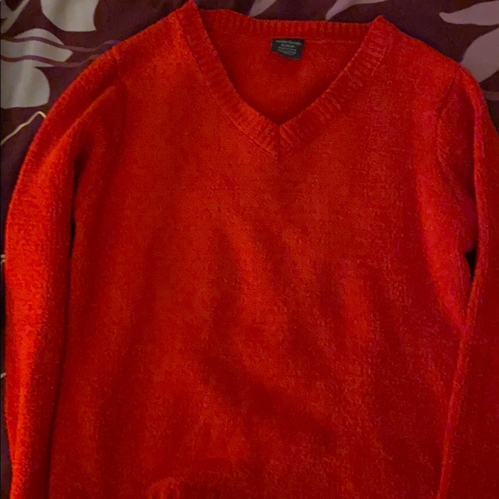 Red fleeced sweater.